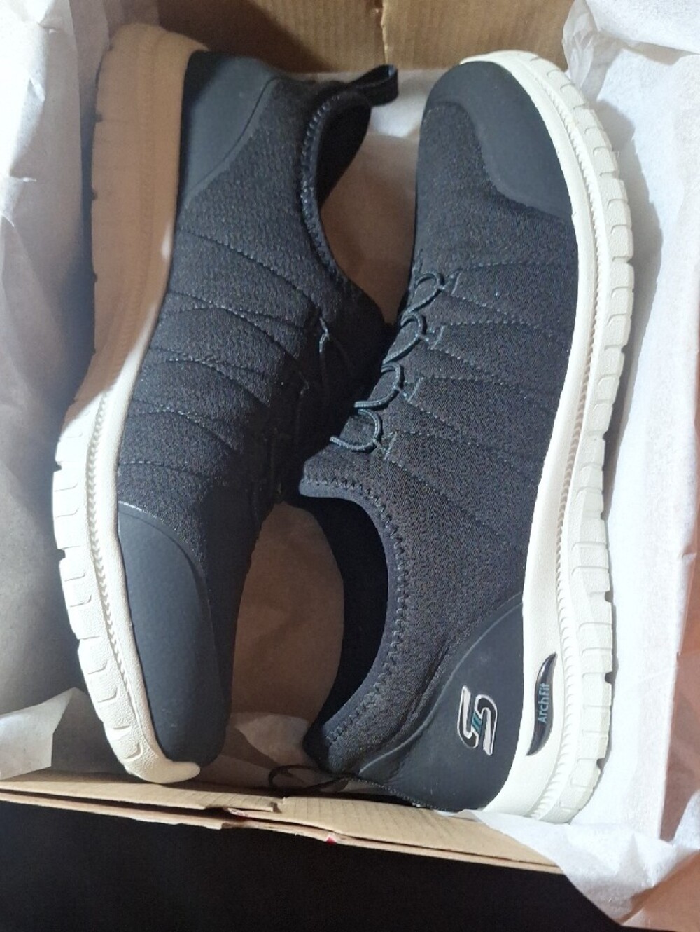 Skechers Women’s Black Slip-On Athletic Sneakers with White Sole